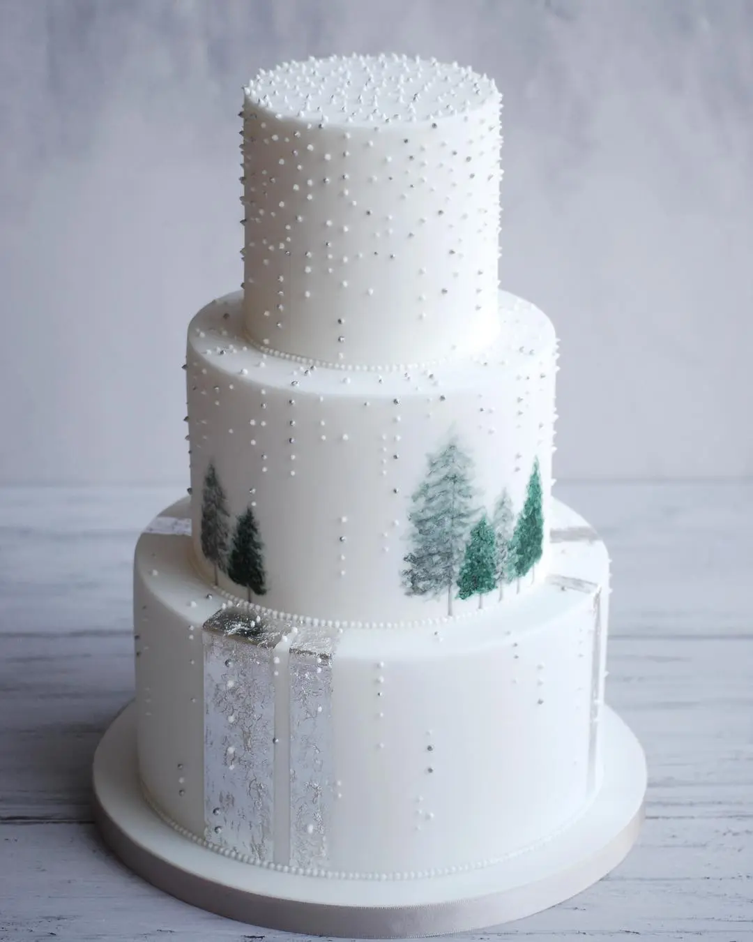 White-Wedding-Cake-with-Fir-Trees-by-Brambleolai