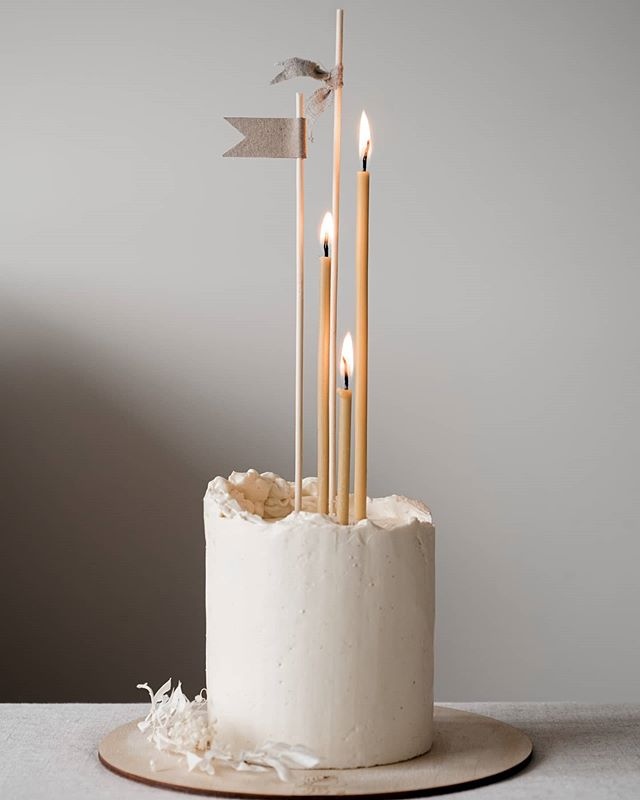 white-winter-wedding-cake-with-candles-by-Fern-Cakery
