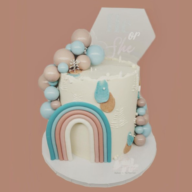 Gender reveal cakes with a rainbow
