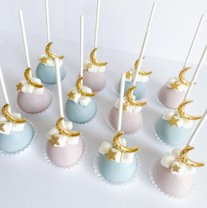 Gender reveal cake pops with moons and stars
