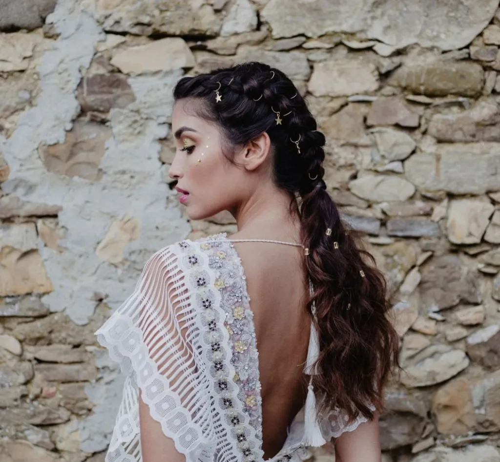 boho-low-ponytail-french-braided-wedding-hairstyles-for-brides-with-celestial-hair-pins