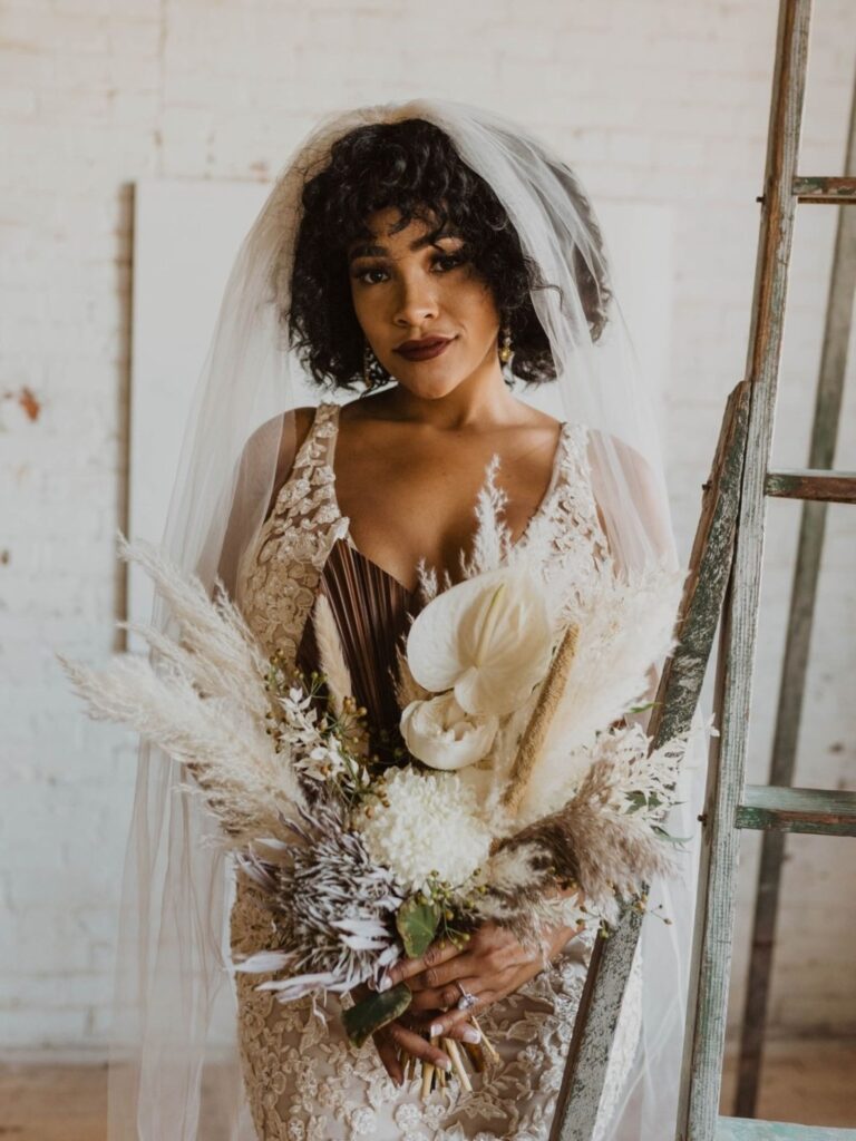 elegant-curly-hair-down-best-wedding-hairstyles-for-bride-with-bangs-and-veil