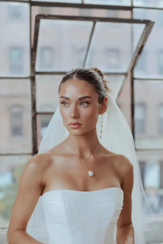 elegant-slicked-back-bun-wedding-hairstyle-inspo-with-veil