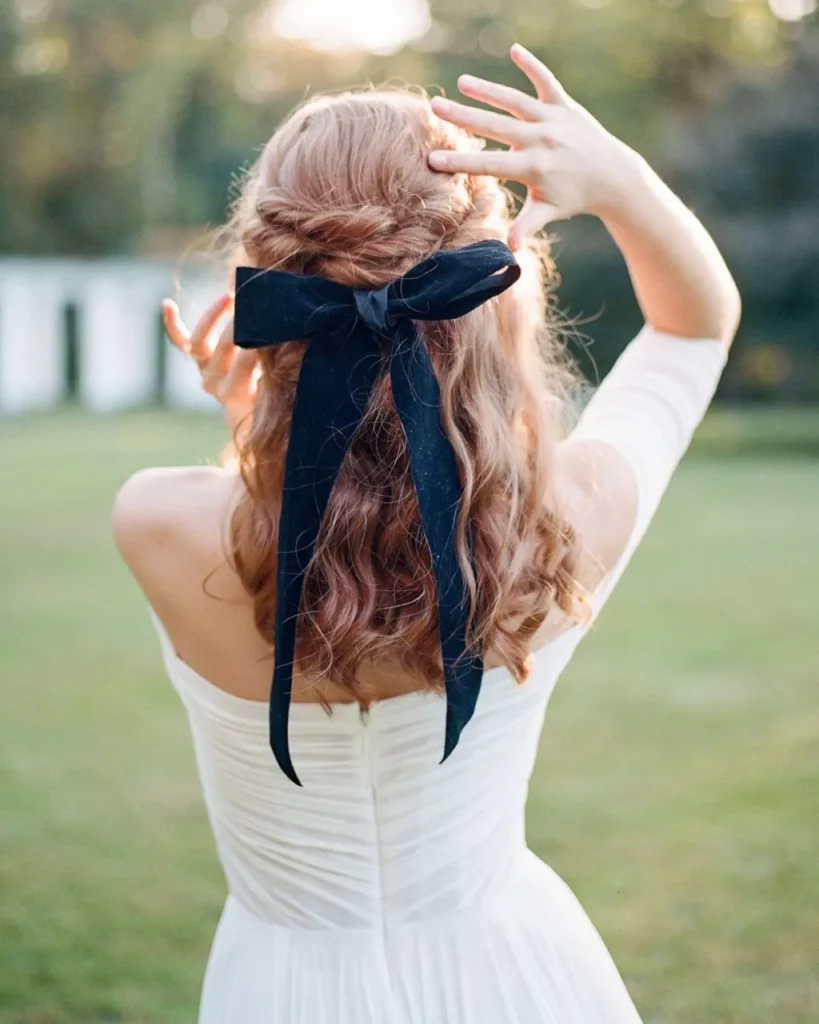 elegant-twisted-hair-down-best-curly-wedding-hairstyles-with-bridal-bow